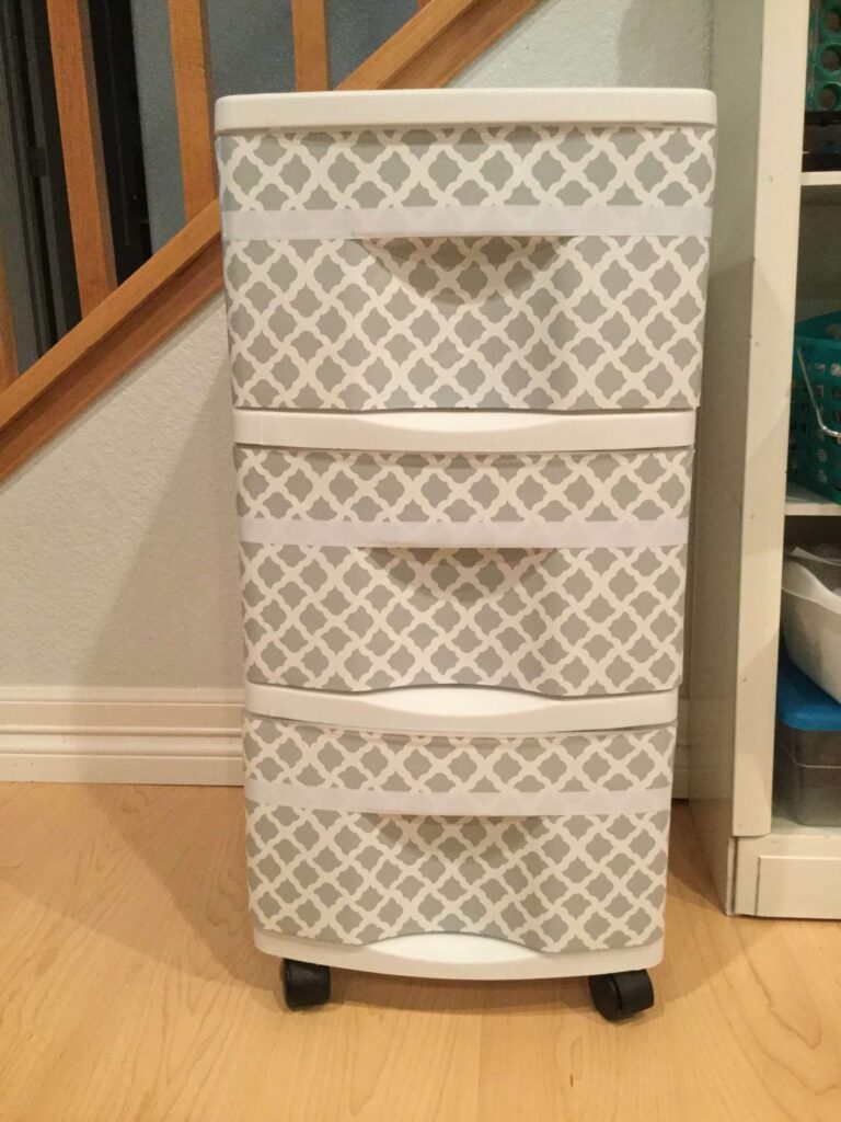 I have these 3 drawer storage containers several places in our home. Sometimes I like that I can see what's in the drawer, and other times I do not. I came up with an easy and inexpensive way to upcycle the drawers - hiding what's inside and giving it a face lift at the same time.