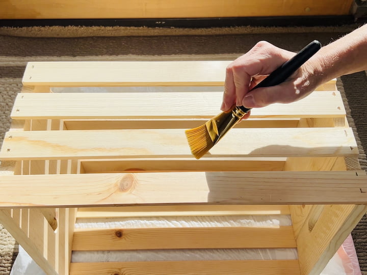 Step 3: Varnish the CrateApply folk art home decor varnish to the crate's exterior and interior. If you prefer a stained or painted look, do this step first. Let the varnish dry completely before moving on to the next step.