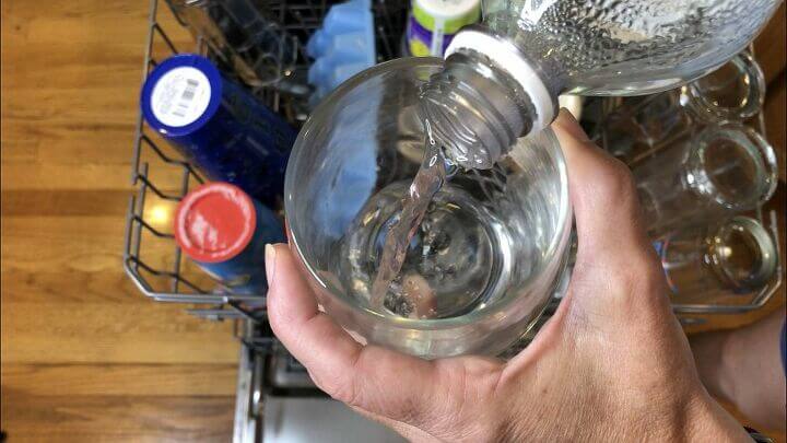 pouring vinegar into a glass