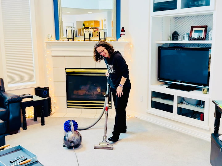 chas vacuuming carpet