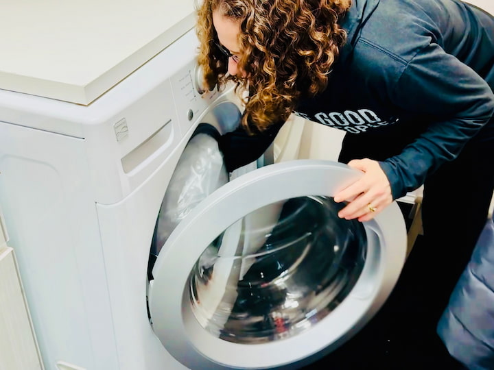 Putting the shower curtain in the washing machine