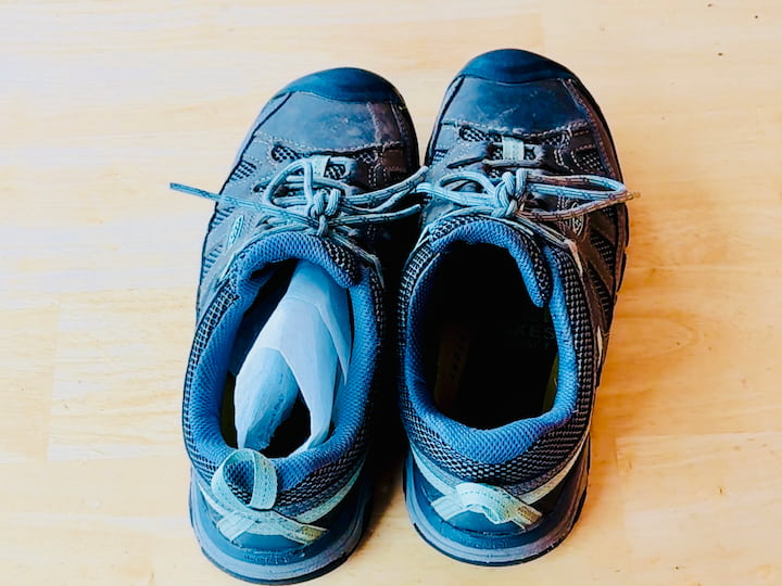 Shoes with dryer sheet inside