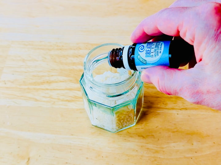 rice in jar and adding essential oils to it