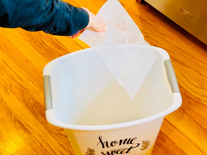 add dryer sheet to the bottom of trashcan