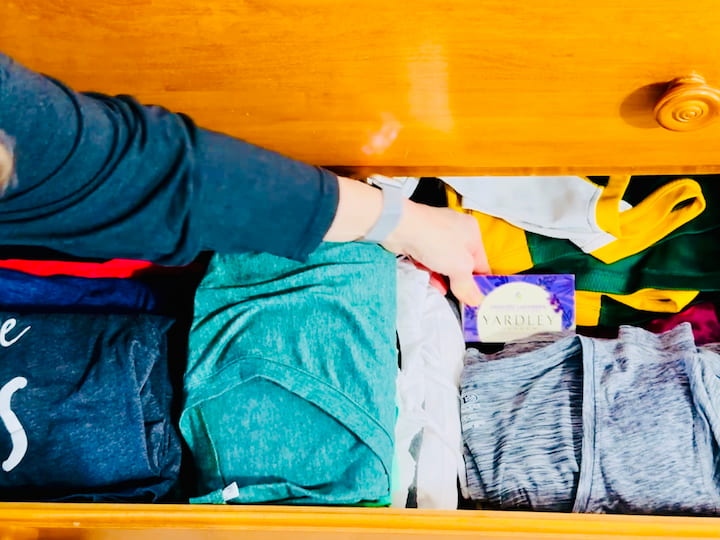 placing bar of soap into drawer