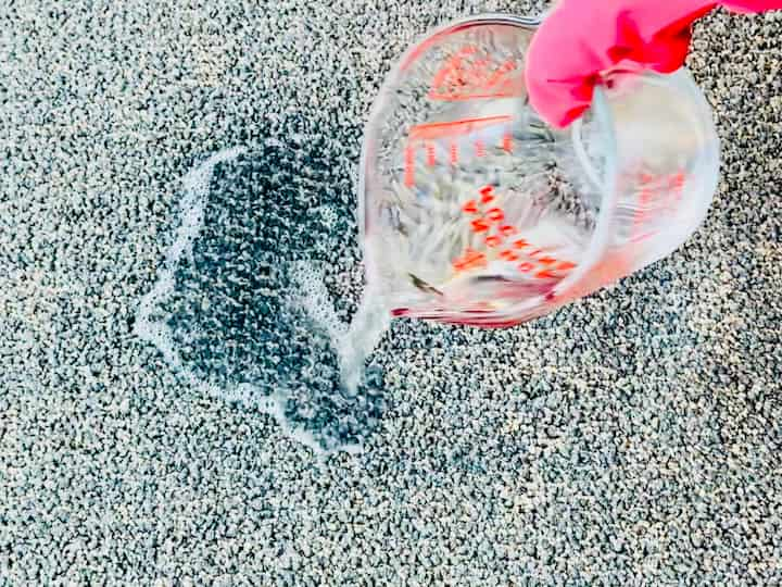 pouring clean water on carpet