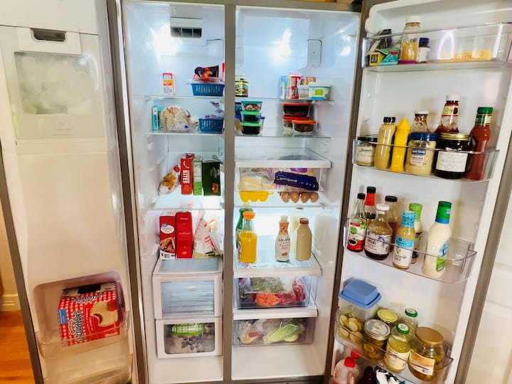 Empty refrigerator and freezer compartments. Wash drawers and shelves in soapy water, dry, and reassemble. Clean the interior of the fridge and freezer, organize items, and discard expired items.