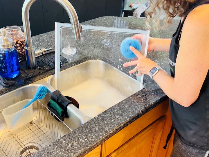 Empty refrigerator and freezer compartments. Wash drawers and shelves in soapy water, dry, and reassemble. Clean the interior of the fridge and freezer, organize items, and discard expired items.