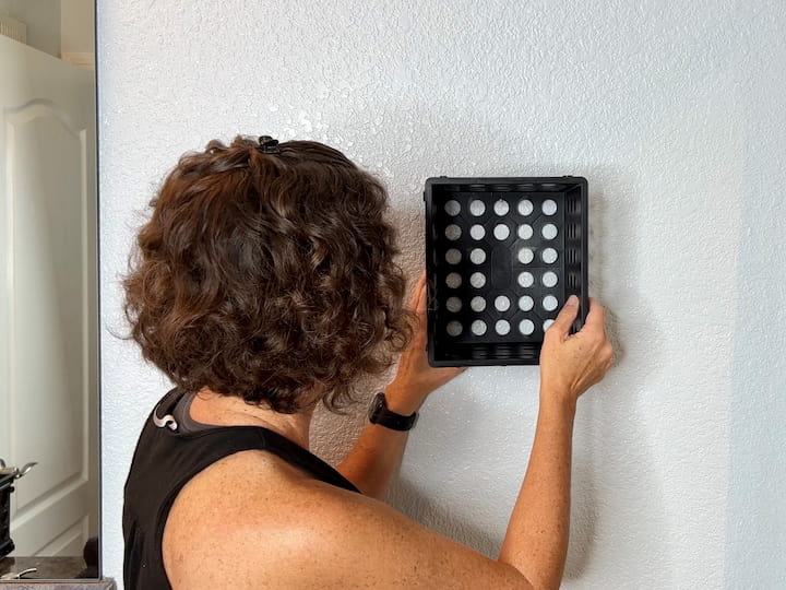 Create storage in places using the smaller mini crates.  I hung this one on a wall in a bathroom that doesn't have much storage.  You can easily use a command hook too.  