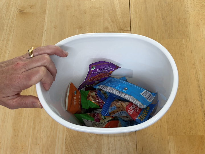 Another option of what you can do with this simple idea is to put snacks in it.  Kids are coming in and hungry all the time you can separate them out per container by protein snacks and Carby snacks and fruit snacks. Next, you just get your container and place your snacks into the container for easy grab-and-go. 