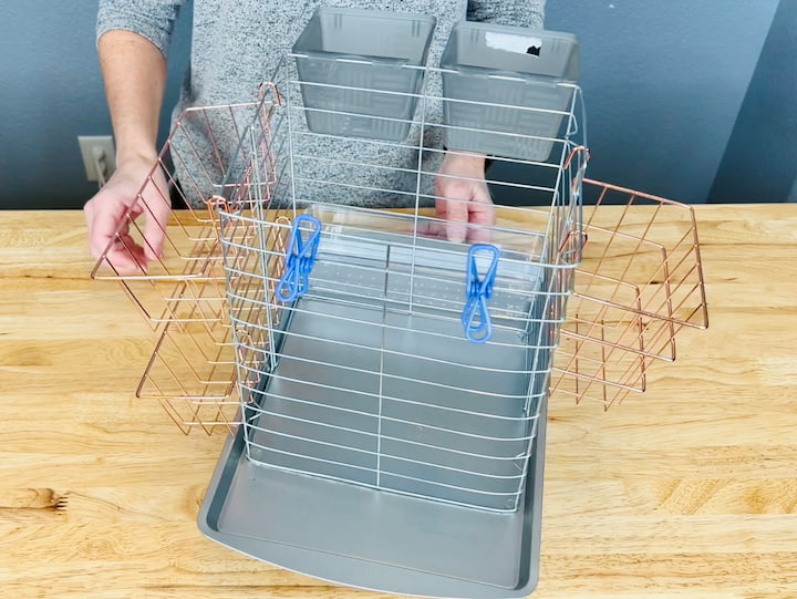  I added two clips. Keep in mind, all of this is interchangeable and adjustable so you can really add any sort of small storage bin you like.  This should help you tackle the disarray and organize the clutter. 