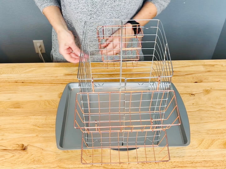 Two shallow baskets hang on top of each other.  