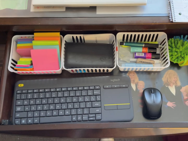 This is my drawer it opens up and it has my keyboard in it for typing for the computer. I have organized trays here because I had some extra space to work with that I used my Post-It notes, my calculator, my pens and pencils, and then these are little dusters.