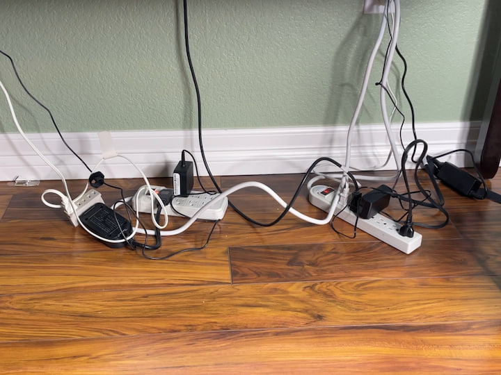 I'm not a big fan of cords under my desk so I took a dollar store bin, however, this storage bin is a little flimsy but they look nice. I placed a plastic bin inside, and put my extension cord with all of the plugs in there. 