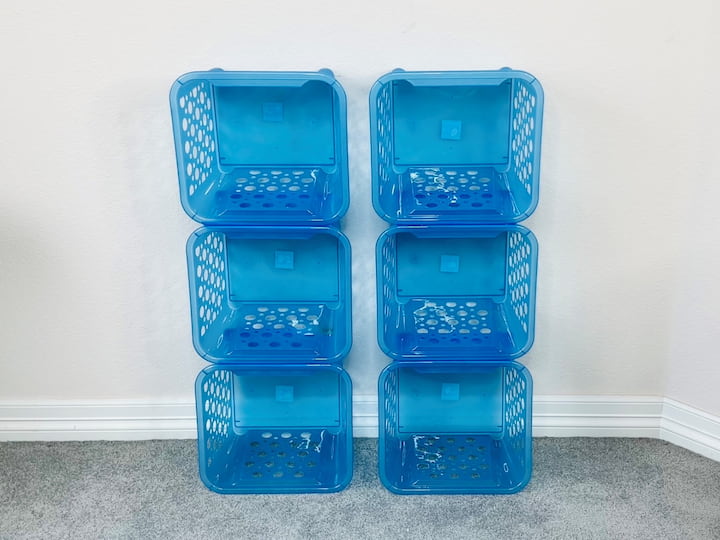 I placed the baskets vertically against a wall and placed my foam core board on top of the shelving unit. I placed the poster board into the bottom of each of the baskets to keep things from falling through the holes.