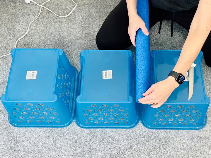 After you've decided what direction you want your baskets to go place the three baskets upside down.  Measure your pool noodles so they will fit between each of the baskets.  