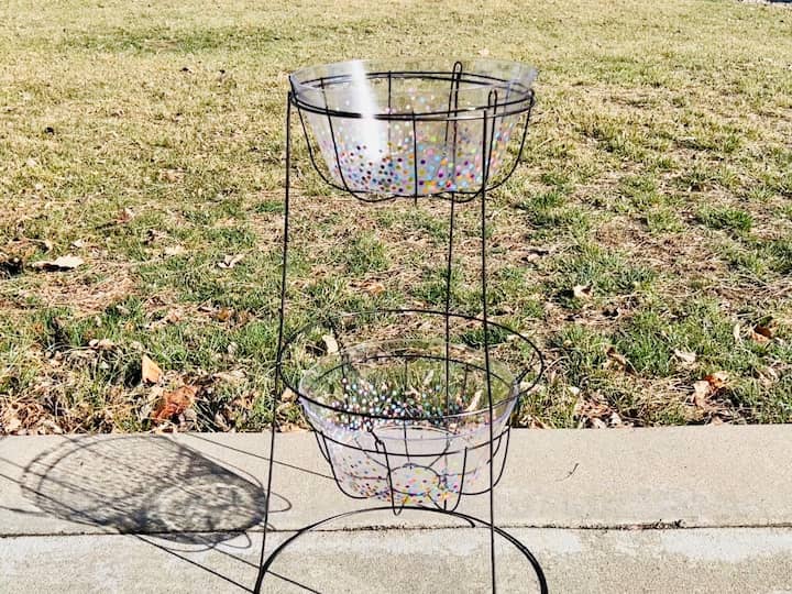 The baskets have holes in them so I bought 2 small cute confetti bowls from Dollar Tree to place in the baskets.   I simply removed the labels from the bottom and placed those into the baskets to provide a solid base.  