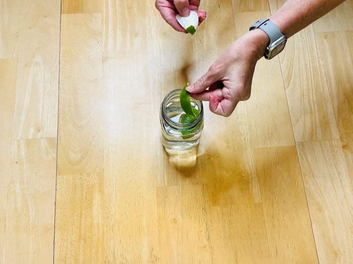 1. Fill a mason jar with vinegar and add citrus peels and fresh herbs.