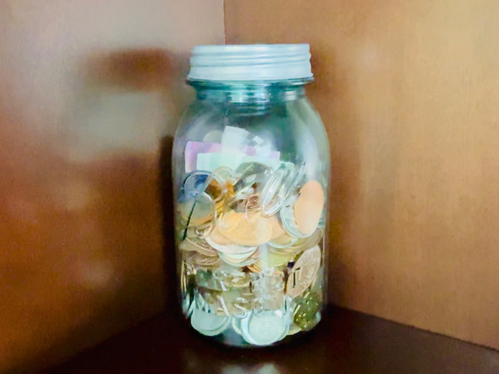 glass jar holding pressed pennies and keepsakes