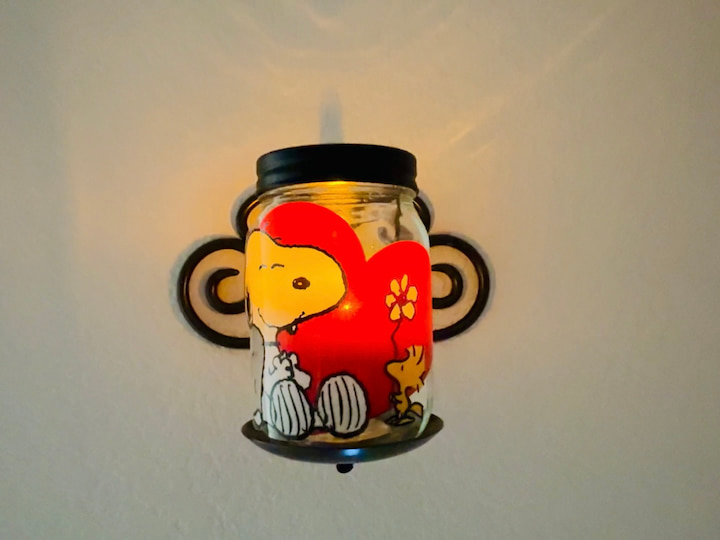 glass jar with window cling on it