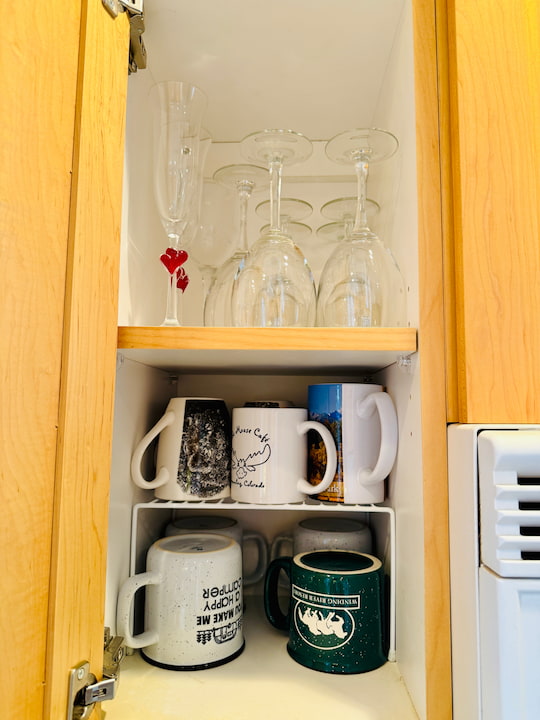 organized stemware and mugs with bonus shelf